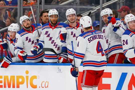 The New York Rangers celebrate a goal scored by defensemen Braden Schneider (4) during the second period against the Edmonton Oilers at Rogers Place