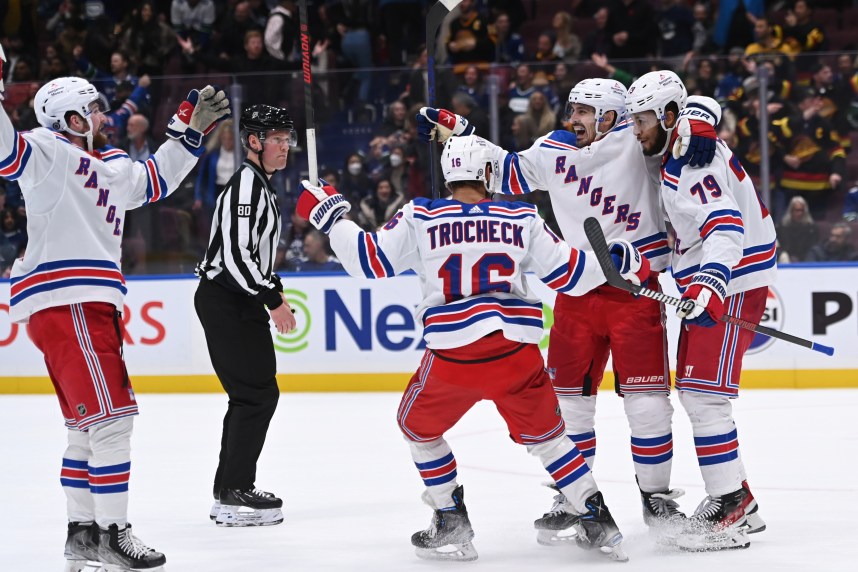 New York Rangers defence K'Andre Miller (79) celebrates a goal with teammates against the Vancouver Canucks during the overtime period at Rogers Arena