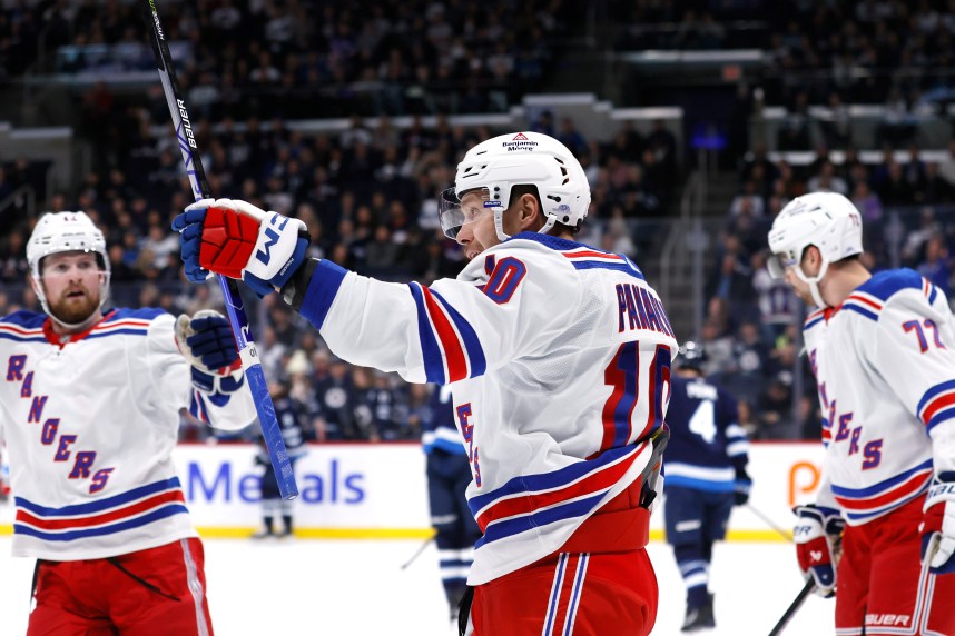 New York Rangers left wing Artemi Panarin (10) celebrates his first period goal against the Winnipeg Jets at Canada Life Centre