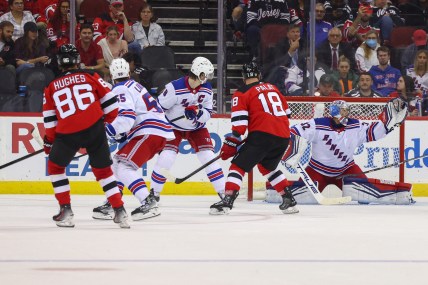 New York Rangers goaltender Jonathan Quick (32) makes a glove save against the New Jersey Devils during the third period at Prudential Center