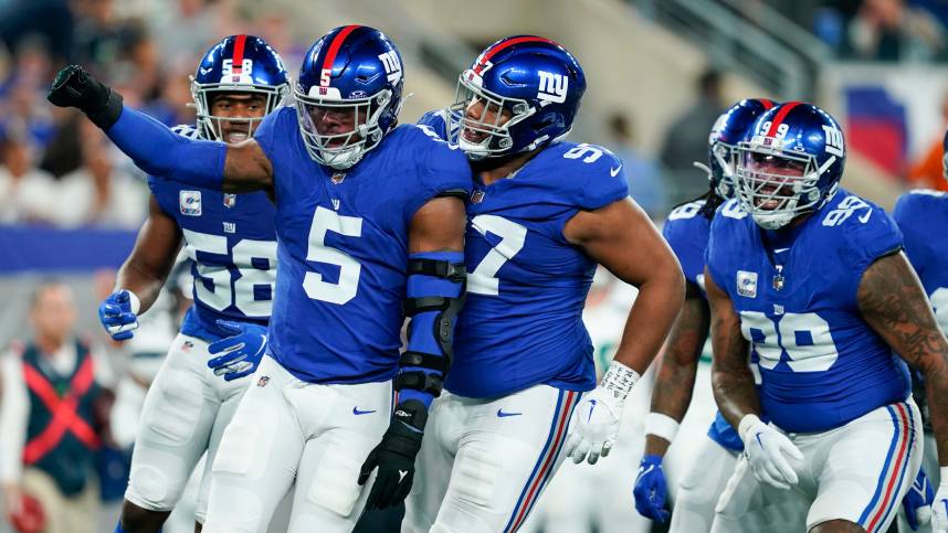 New York Giants linebacker Kayvon Thibodeaux (5) celebrates a sack with the defense in the first half at MetLife Stadium