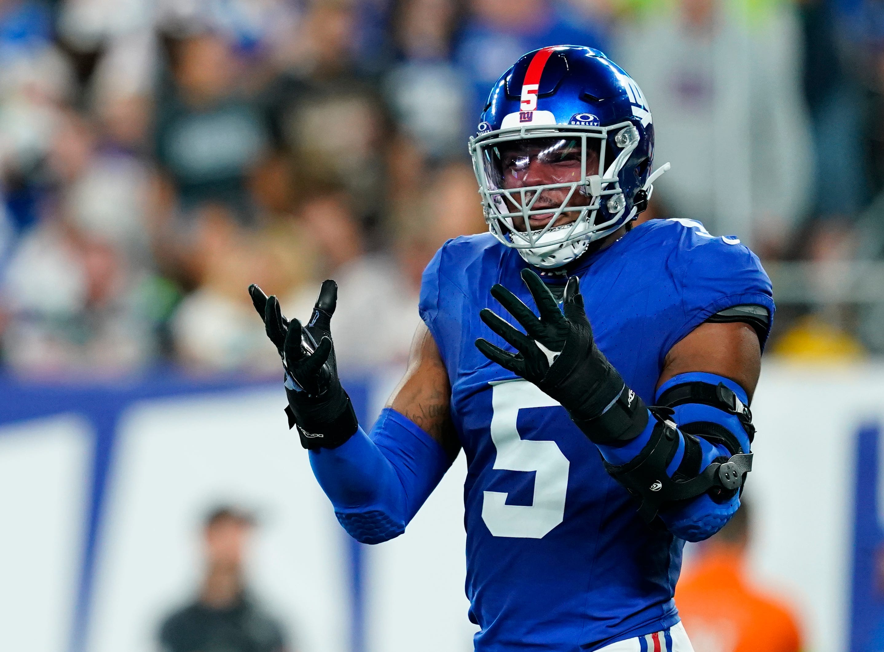 New York Giants linebacker Kayvon Thibodeaux (5) reacts to nearly intercepting Seattle Seahawks quarterback Geno Smith (not pictured) in the first half at MetLife Stadium