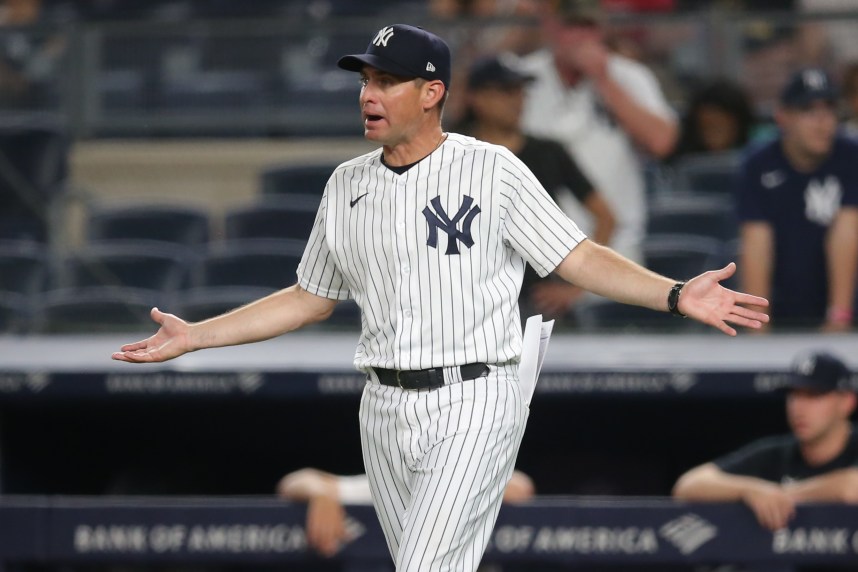 New York Yankees bench coach Carlos Mendoza (64) reacts after being ejected during the tenth inning against the Boston Red Sox at Yankee Stadium (Mets)