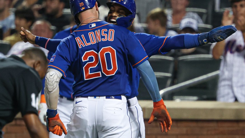 New York Mets first baseman Pete Alonso (20) celebrates with shortstop Francisco Lindor (12) after hitting a two-run home run during the third inning against the Chicago Cubs at Citi Field
