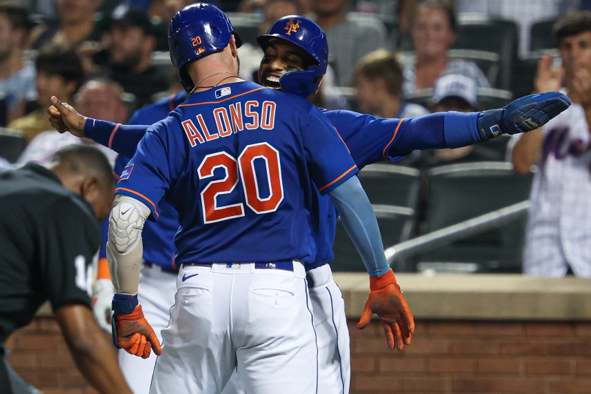 New York Mets first baseman Pete Alonso (20) celebrates with shortstop Francisco Lindor (12) after hitting a two-run home run during the third inning against the Chicago Cubs at Citi Field