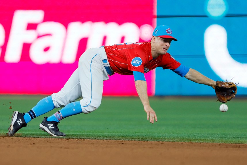 Miami Marlins shortstop Joey Wendle (18) dives but cannot catch a base hit from New York Mets catcher Omar Narvaez (not pictured) during the eighth inning at loanDepot Park