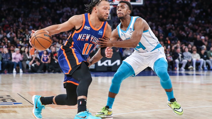 New York Knicks guard Jalen Brunson (11) looks to drive past Charlotte Hornets guard Ish Smith (14) in the second quarter at Madison Square Garden