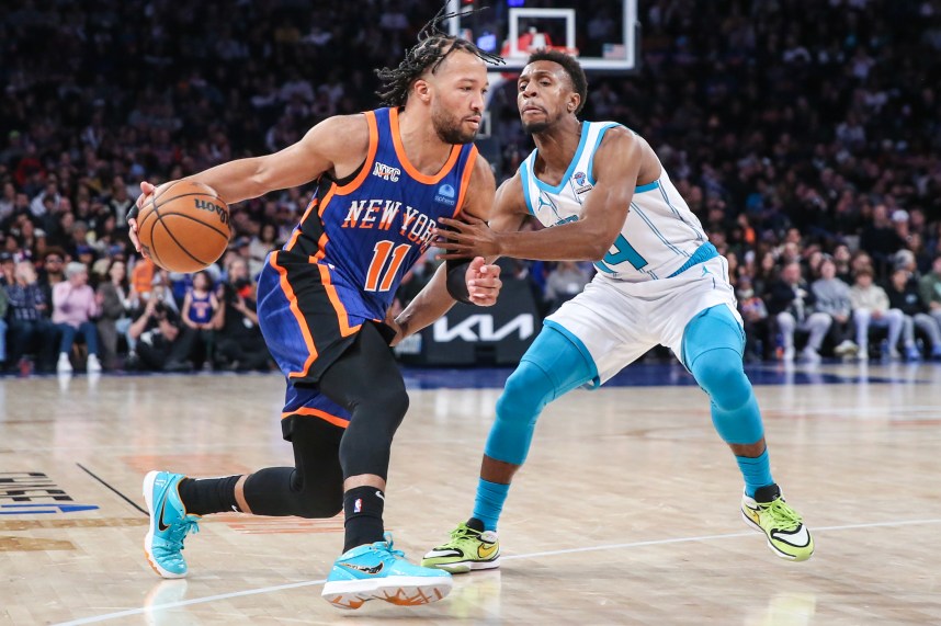 New York Knicks guard Jalen Brunson (11) looks to drive past Charlotte Hornets guard Ish Smith (14) in the second quarter at Madison Square Garden