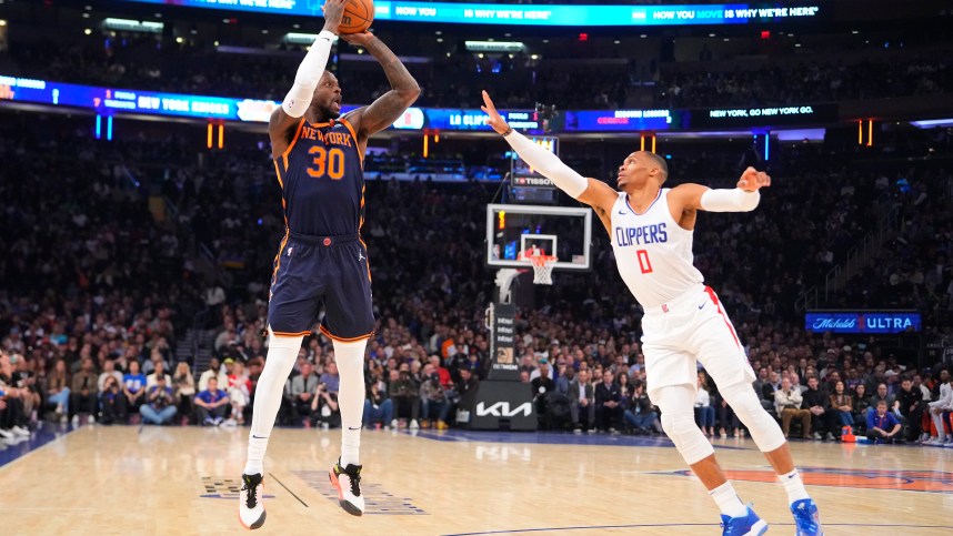 New York Knicks power forward Julius Randle (30) shoots a three point jump shot against Los Angeles Clipper point guard Russell Westbrook (0) during the first quarter at Madison Square Garden