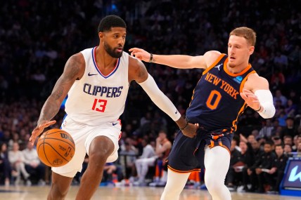 Los Angeles Clipper forward Paul George (13) dribbles the ball against New York Knicks shooting guard Donte DiVincenzo (0) during the fourth quarter at Madison Square Garden