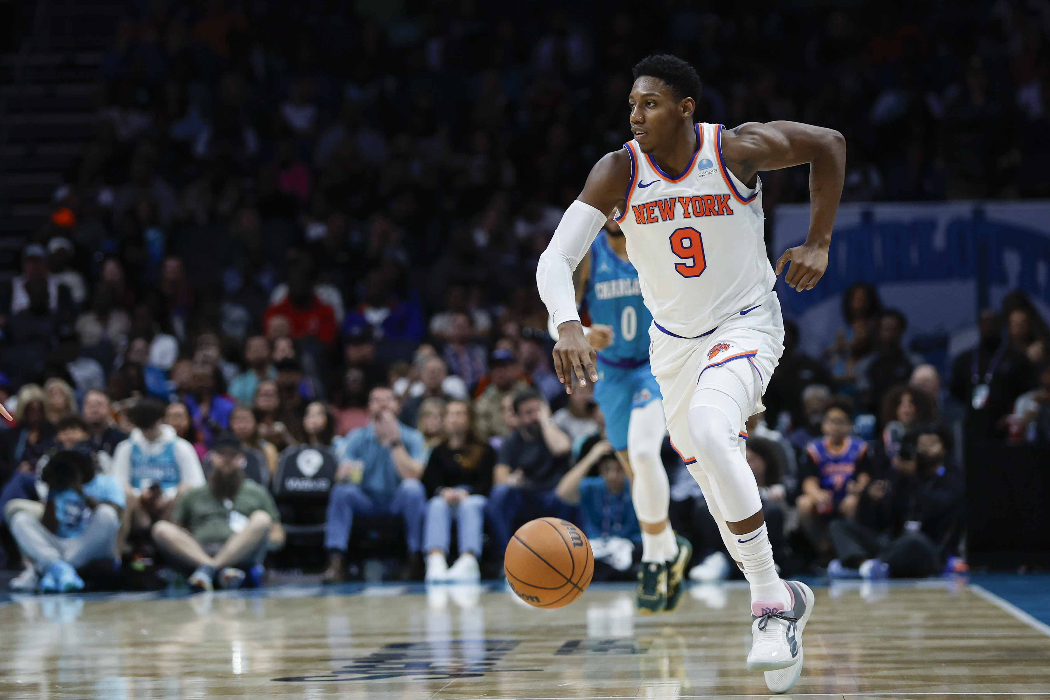 New York Knicks guard RJ Barrett (9) pushes the ball up court against the Charlotte Hornets during the second half at Spectrum Center