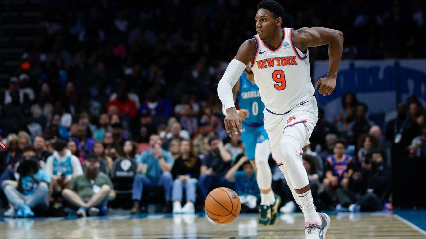 New York Knicks guard RJ Barrett (9) pushes the ball up court against the Charlotte Hornets during the second half at Spectrum Center