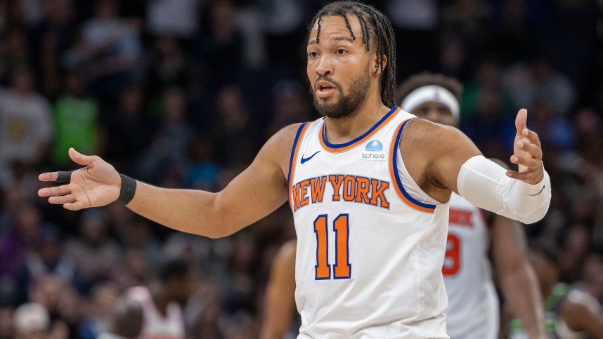 New York Knicks guard Jalen Brunson (11) looks towards the bench after a call on the floor against the Minnesota Timberwolves in the second half at Target Center
