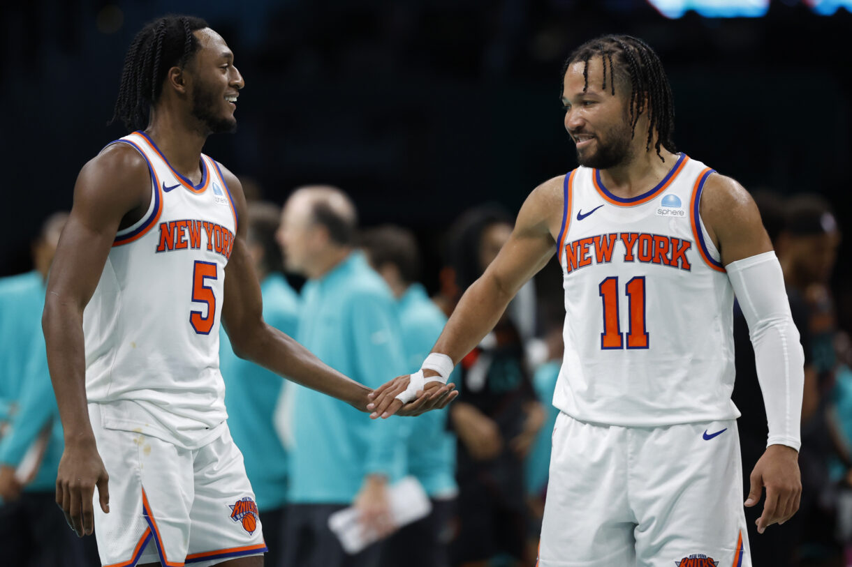 New York Knicks guard Immanuel Quickley (5) celebrates with Knicks guard Jalen Brunson (11) against the Washington Wizards in the fourth quarter at Capital One Arena