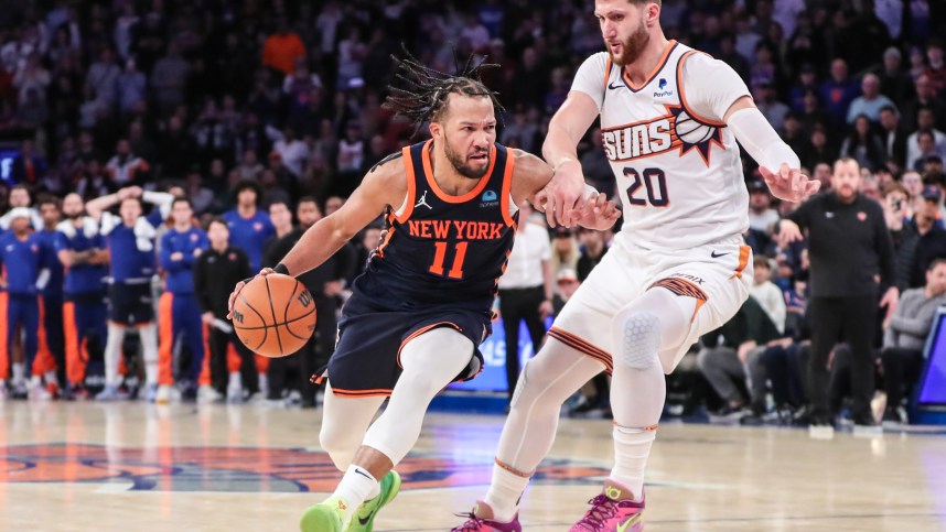 New York Knicks guard Jalen Brunson (11) drives past Phoenix Suns center Jusuf Nurkic (20) in the fourth quarter at Madison Square Garden