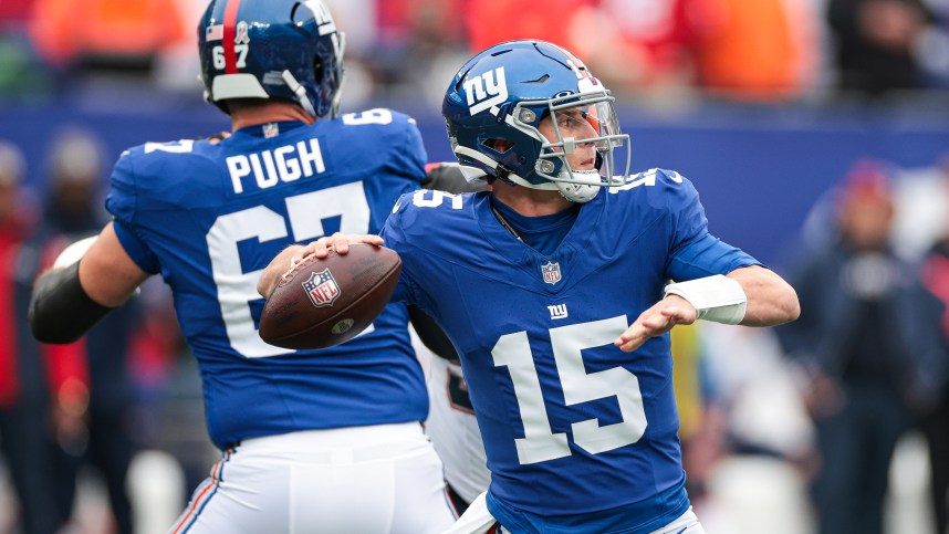 New York Giants quarterback Tommy DeVito (15) throws the ball during the first half against the New England Patriots at MetLife Stadium