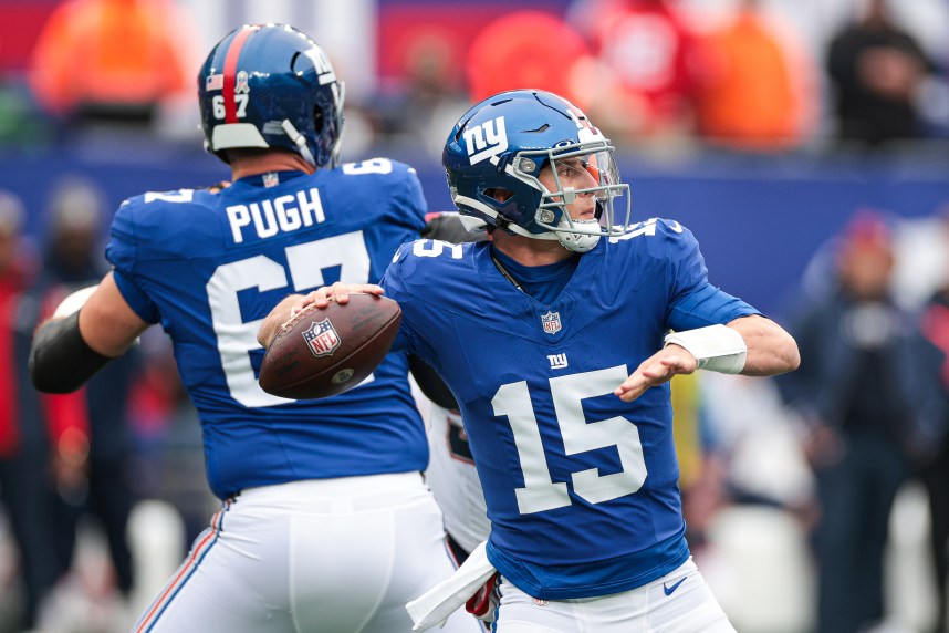 New York Giants quarterback Tommy DeVito (15) throws the ball during the first half against the New England Patriots at MetLife Stadium