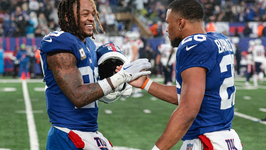 New York Giants safety Xavier McKinney (29) celebrates with running back Saquon Barkley (26) after a New England Patriots missed field goal during the fourth quarter at MetLife Stadium