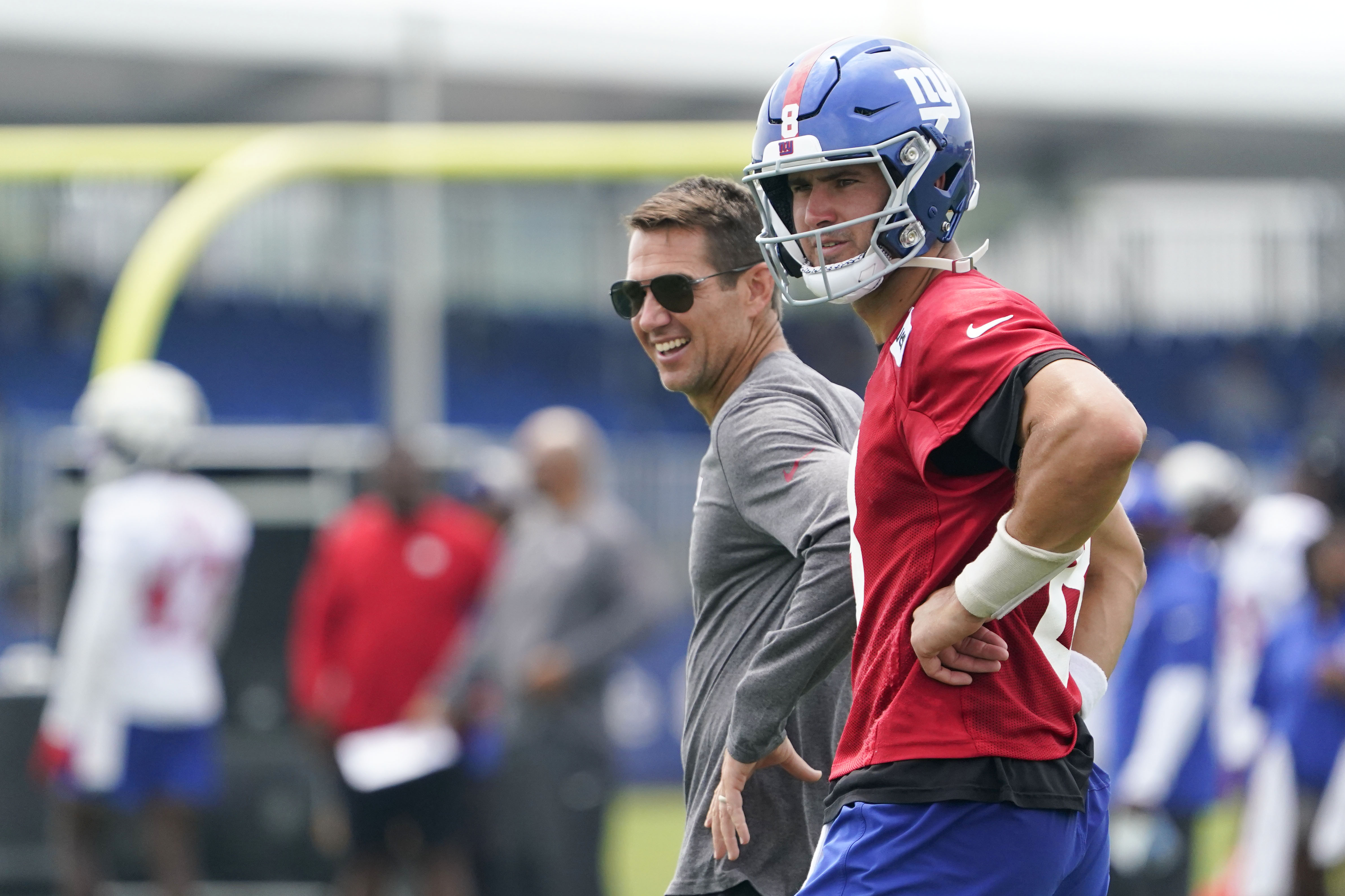 New York Giants quarterback Daniel Jones (8) and general manager Joe Schoen, left, on day two of training camp at the Quest Diagnostics Training Facility