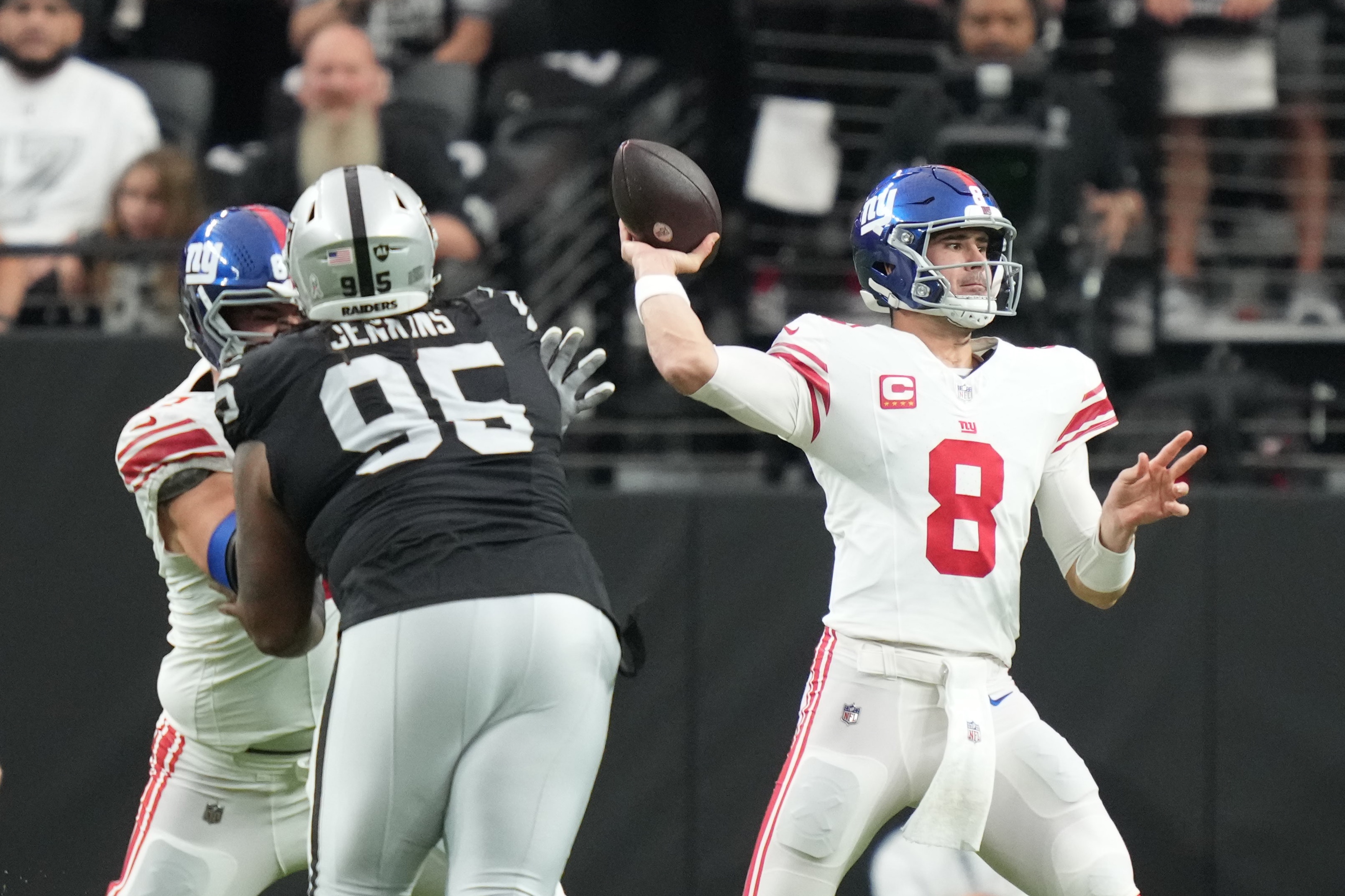 New York Giants quarterback Daniel Jones (8) passes the football against the Las Vegas Raiders during the first quarter at Allegiant Stadium