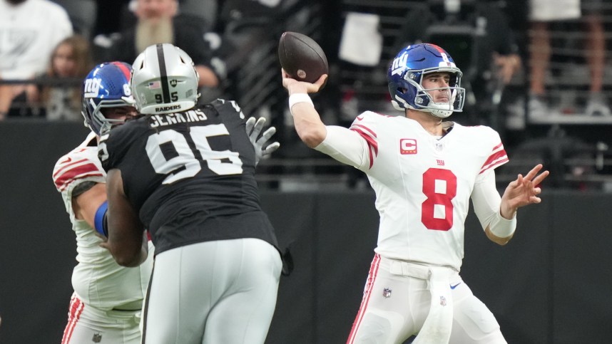 New York Giants quarterback Daniel Jones (8) passes the football against the Las Vegas Raiders during the first quarter at Allegiant Stadium