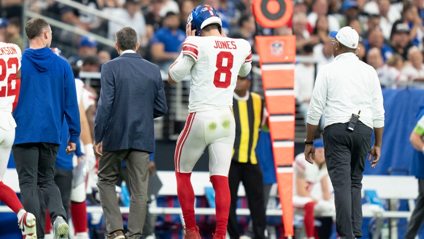 New York Giants quarterback Daniel Jones (8) walks to the sideline after an injury against the Las Vegas Raiders during the second quarter at Allegiant Stadium