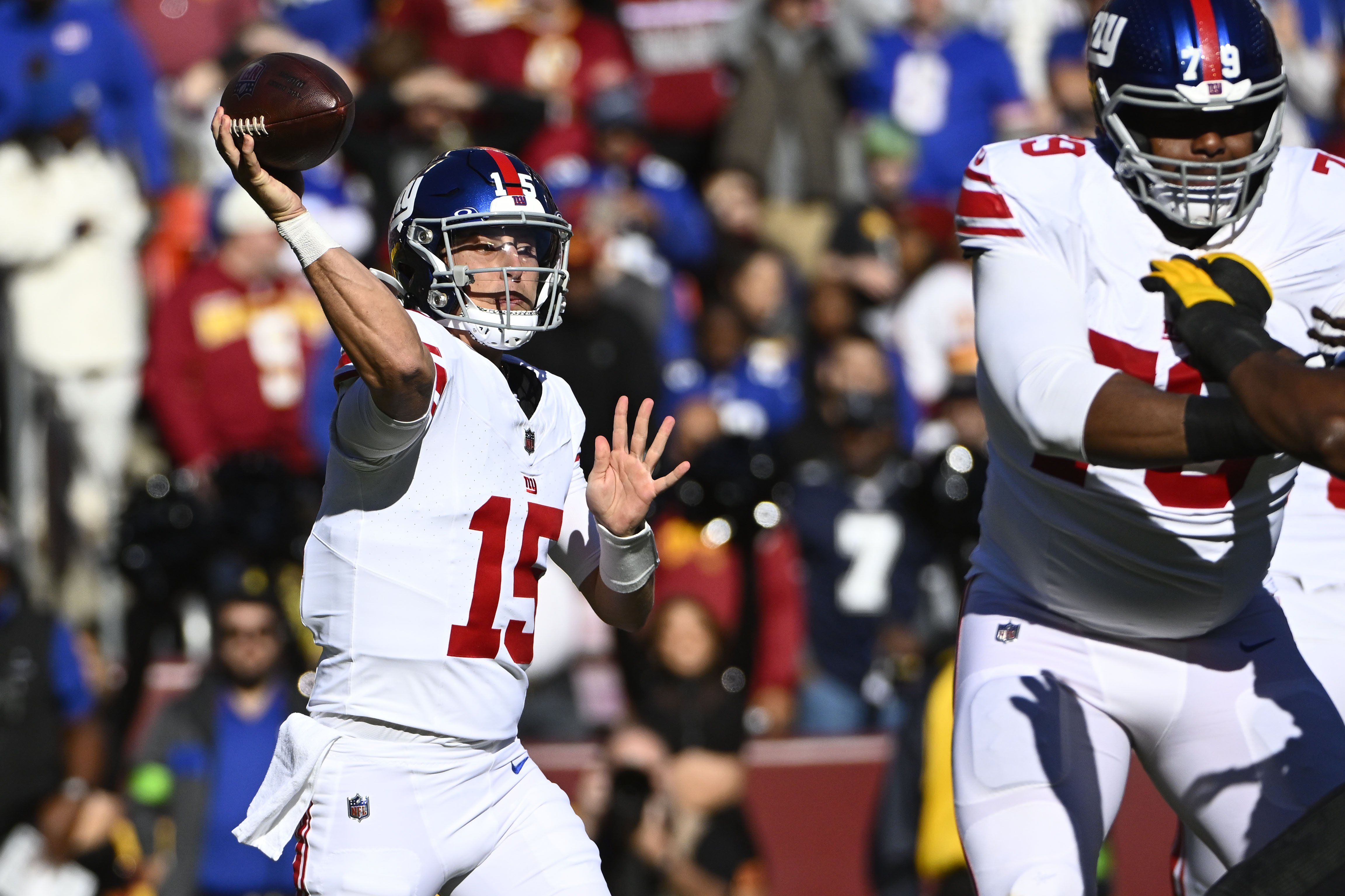 New York Giants quarterback Tommy DeVito (15) attempts a pass against the Washington Commanders during the first half at FedExField