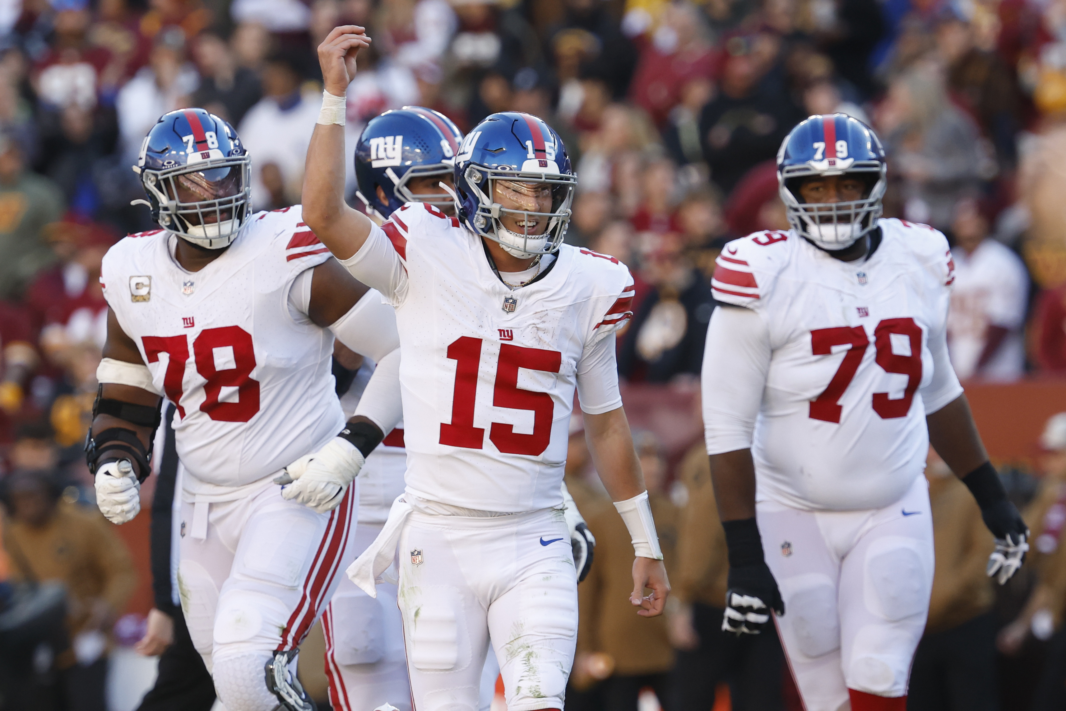New York Giants quarterback Tommy DeVito (15) celebrates after throwing a touchdown pass against the Washington Commanders during the second quarter at FedExField