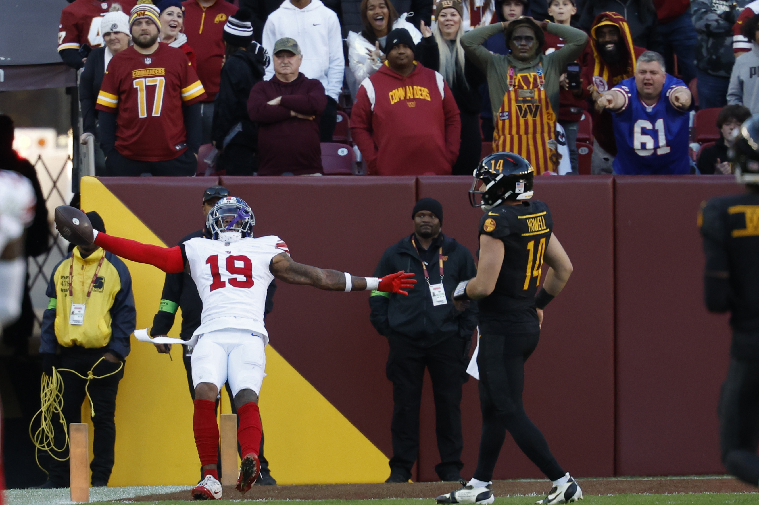 New York Giants safety Isaiah Simmons (19) celebrates while scoring a touchdown on an interception of Washington Commanders quarterback Sam Howell (14) in the final minute during the fourth quarter at FedExField