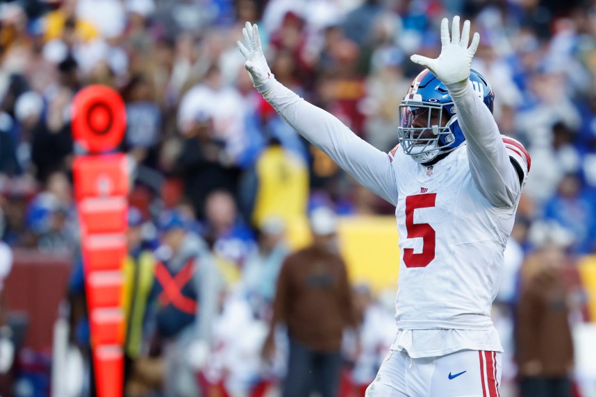 New York Giants linebacker Kayvon Thibodeaux (5) celebrates after making a sack against the Washington Commanders during the fourth quarter at FedExField
