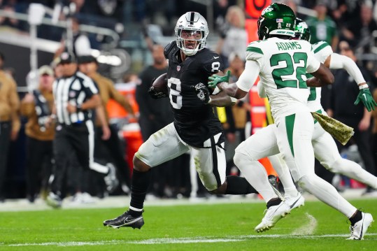 Las Vegas Raiders running back Josh Jacobs (8) runs ahead of New York Jets safety Tony Adams (22) during the third quarter at Allegiant Stadium