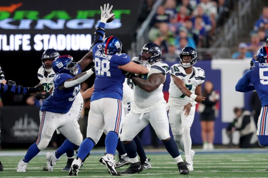New York Giants defensive tackle D.J. Davidson (98) blocks a pass by Seattle Seahawks quarterback Geno Smith (7) during the second quarter at MetLife Stadium