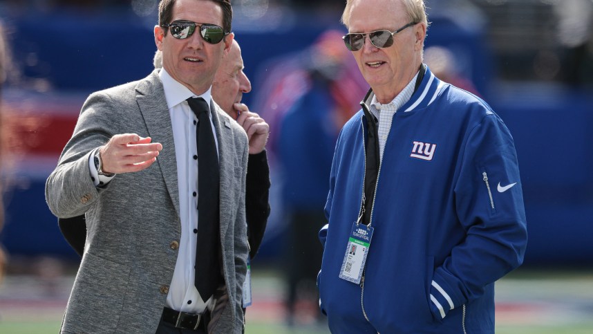 New York Giants general manager Joe Schoen (left) talks with with president and CEO John Mara (right) before the game against the Washington Commanders at MetLife Stadium