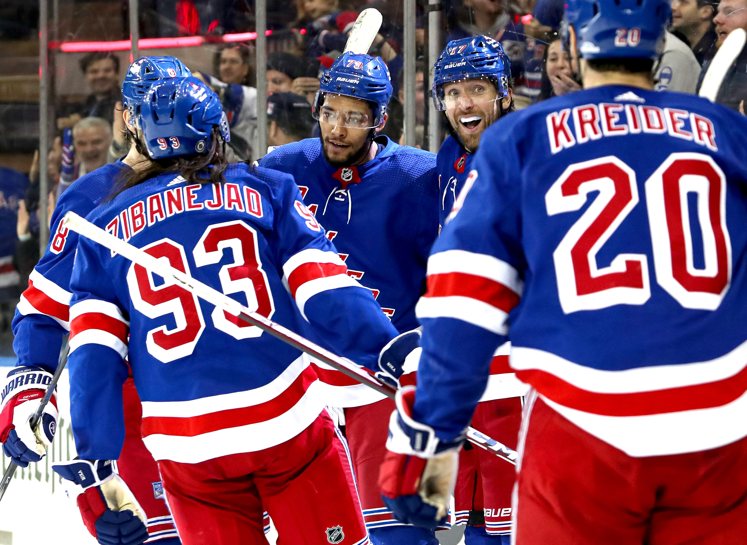 New York Rangers defenseman K'Andre Miller (79) celebrates his goal with center Mika Zibanejad (93), right wing Blake Wheeler (17) and left wing Chris Kreider (20) during the second period against the Boston Bruins at Madison Square Garden