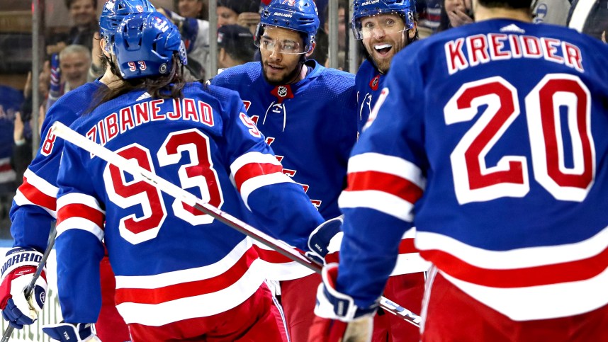 New York Rangers defenseman K'Andre Miller (79) celebrates his goal with center Mika Zibanejad (93), right wing Blake Wheeler (17) and left wing Chris Kreider (20) during the second period against the Boston Bruins at Madison Square Garden