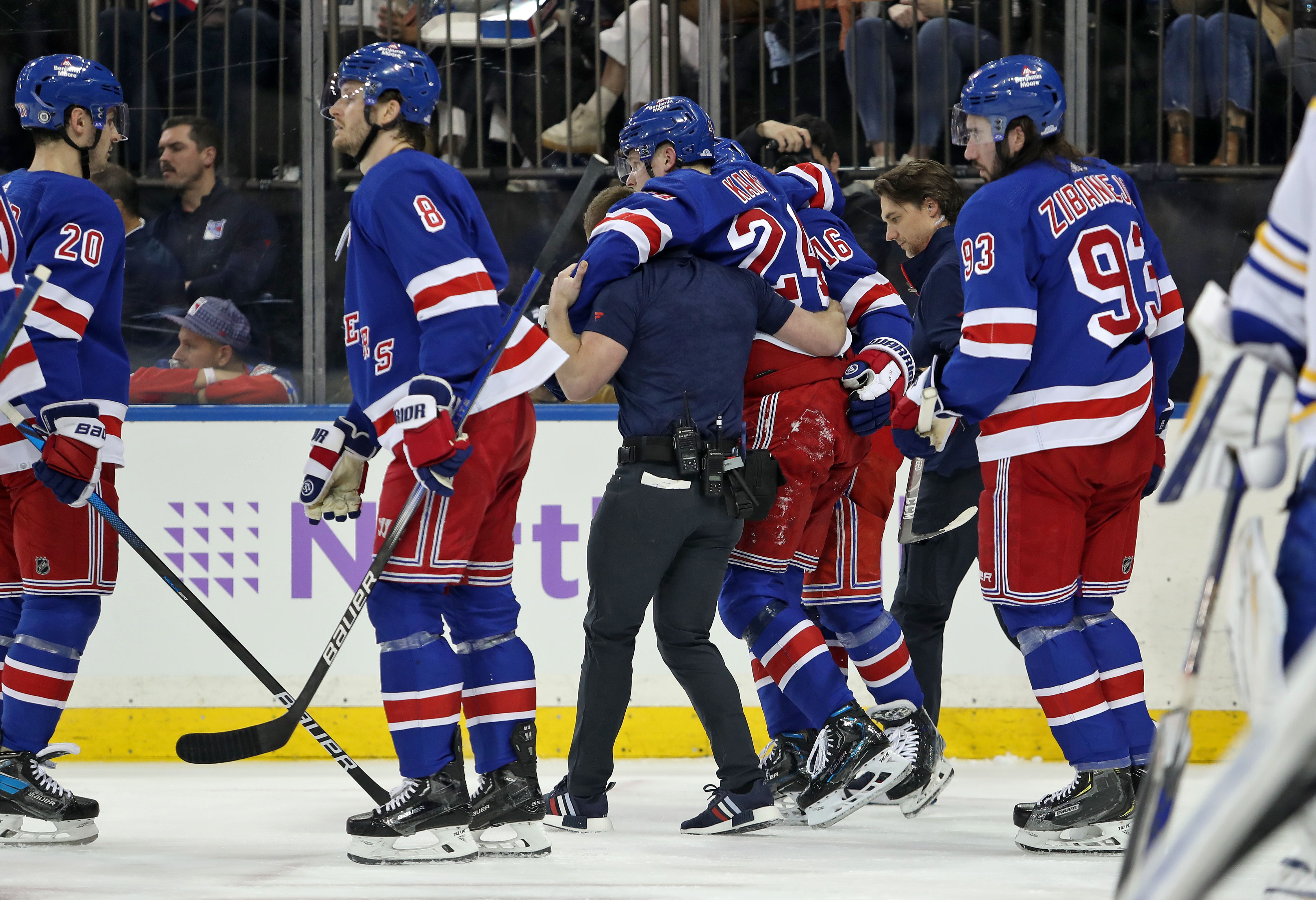 New York Rangers right wing Kaapo Kakko (24) is helped by a trainer on the ice after an injury to his left leg during the second period against the Buffalo Sabres at Madison Square Garden