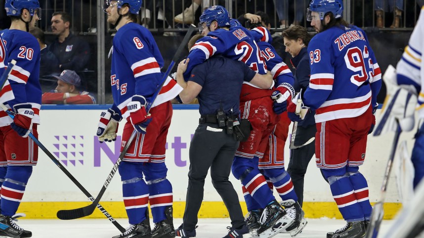 New York Rangers right wing Kaapo Kakko (24) is helped by a trainer on the ice after an injury to his left leg during the second period against the Buffalo Sabres at Madison Square Garden