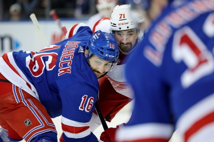 New York Rangers center Vincent Trocheck (16) and Detroit Red Wings center Dylan Larkin (71) fight for a face-off during the third period at Madison Square Garden