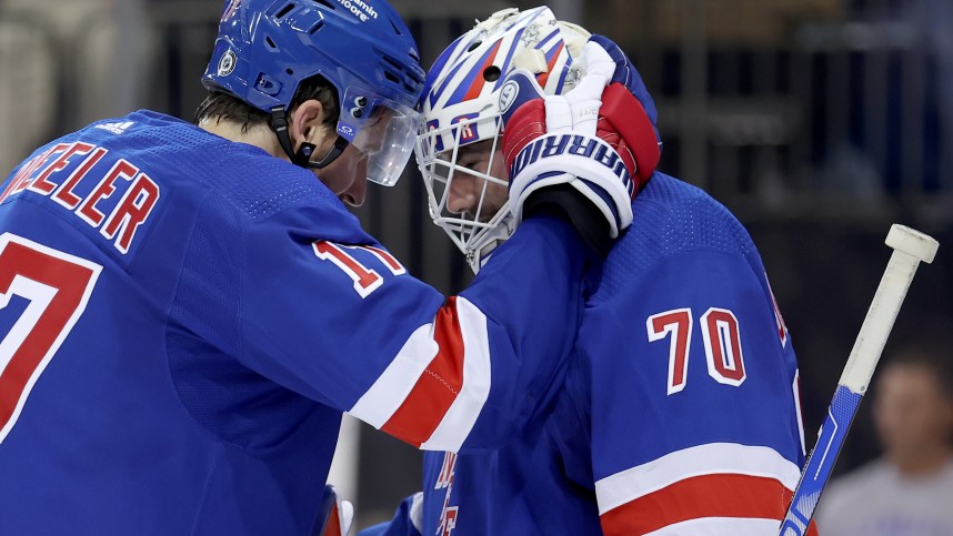 New York Rangers right wing Blake Wheeler (17) celebrates with goaltender Louis Domingue (70) after defeating the Minnesota Wild at Madison Square Garden