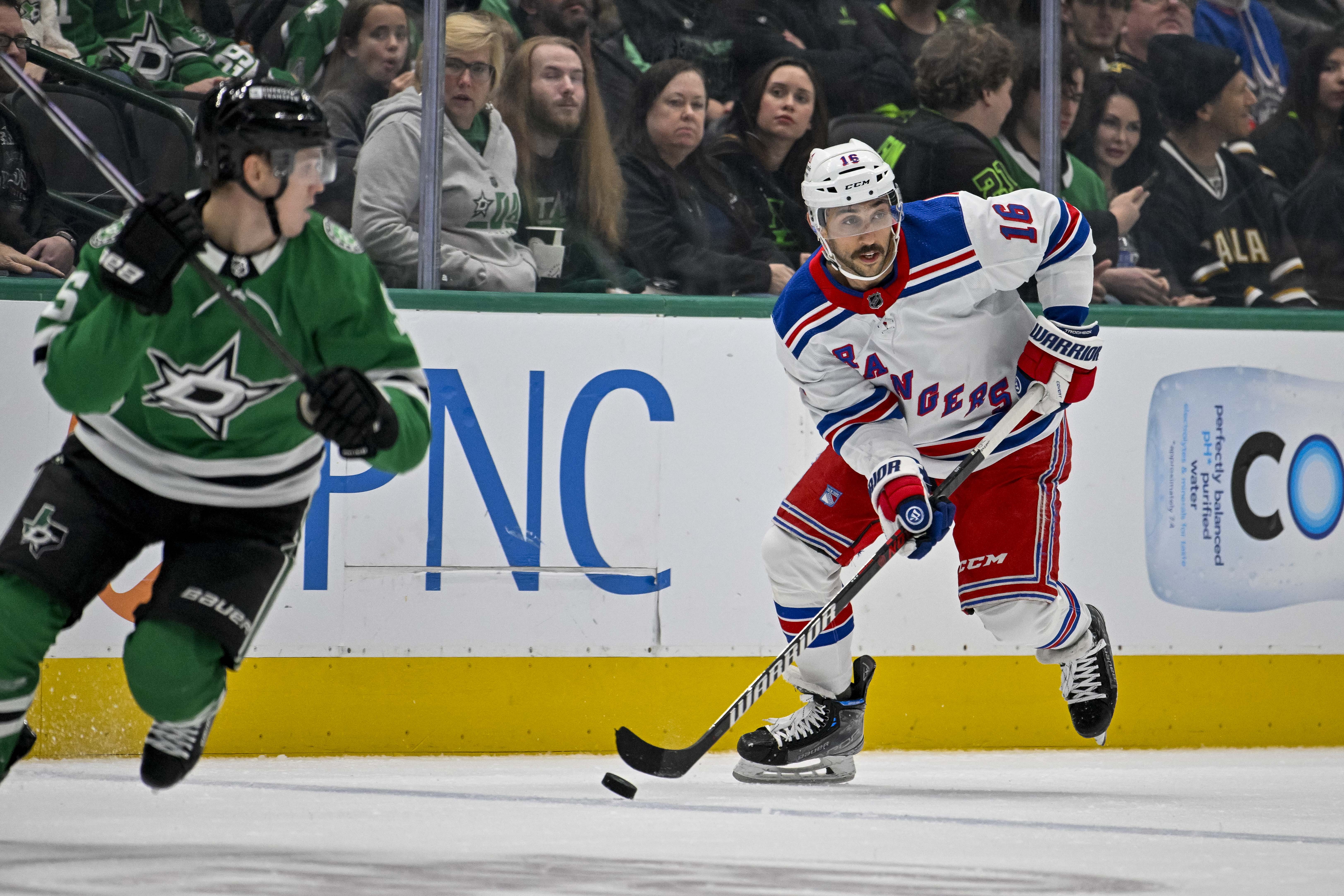 New York Rangers center Vincent Trocheck (16) skates with puck past Dallas Stars defenseman Nils Lundkvist (5) during the first period at the American Airlines Center