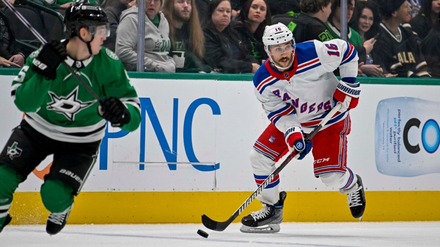 New York Rangers center Vincent Trocheck (16) skates with puck past Dallas Stars defenseman Nils Lundkvist (5) during the first period at the American Airlines Center
