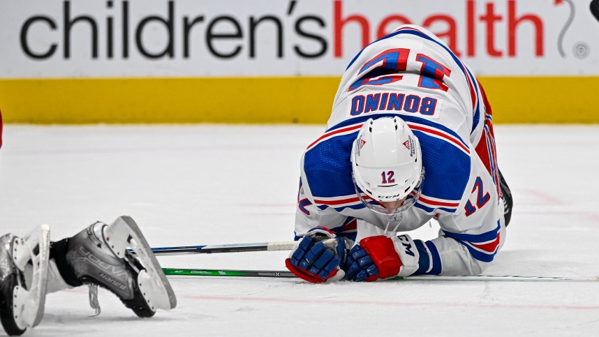 New York Rangers center Nick Bonino (12) falls to the ice during the third period against the Dallas Stars at the American Airlines Center