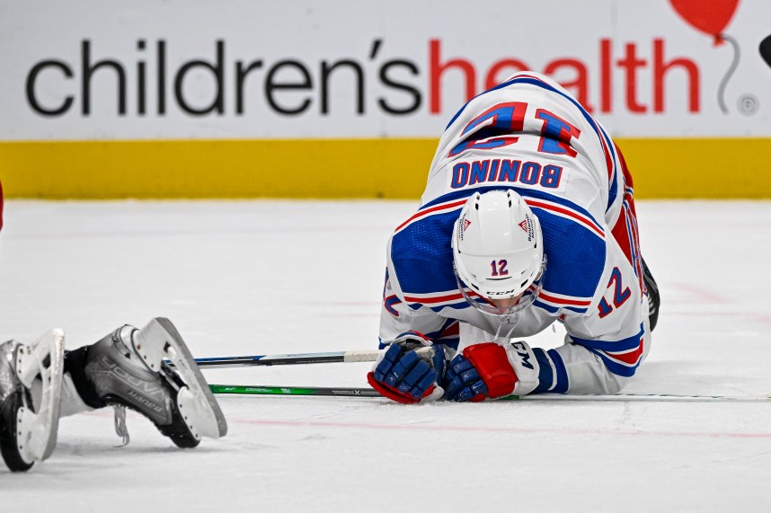 New York Rangers center Nick Bonino (12) falls to the ice during the third period against the Dallas Stars at the American Airlines Center