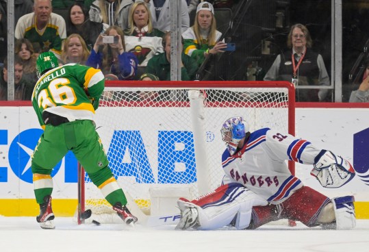 Minnesota Wild forward Mats Zuccarello (36) beats New York Rangers goalie Jonathan Quick (32) for a goal during a shootout at Xcel Energy Center