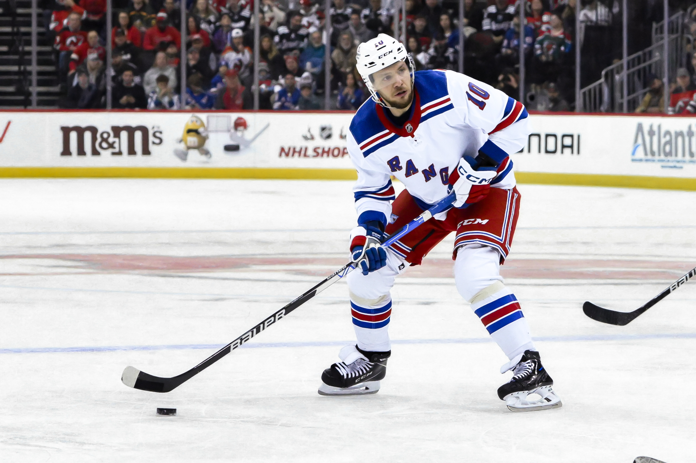 New York Rangers left wing Artemi Panarin (10) looks to pass the puck against the New Jersey Devils during the first period at Prudential Center