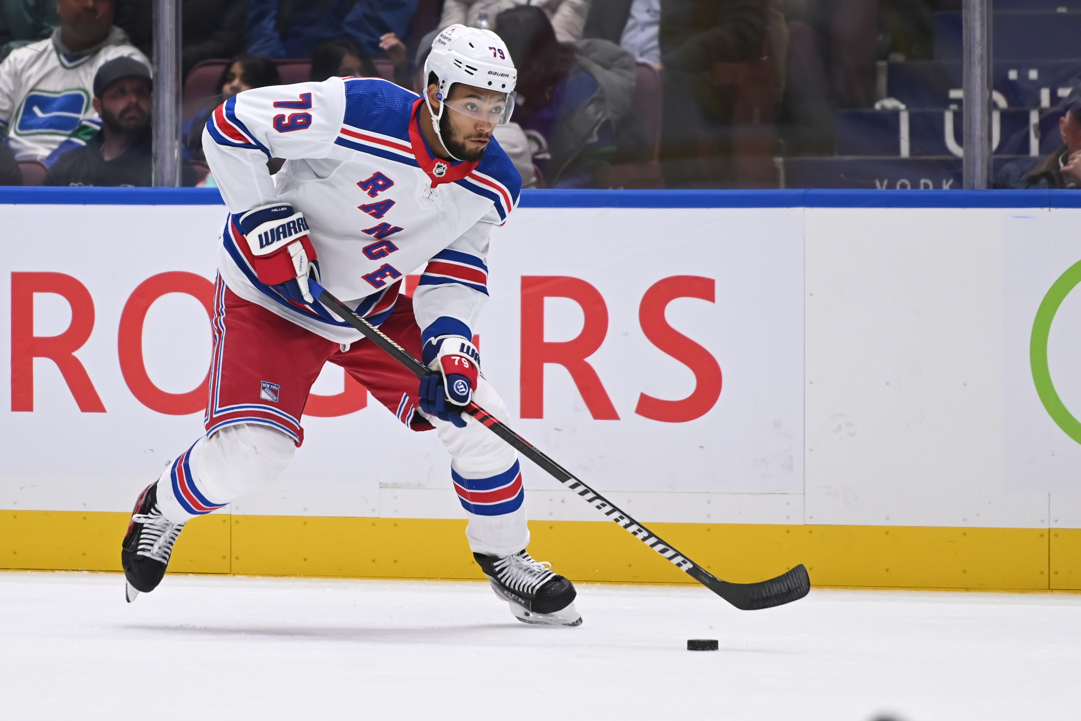 New York Rangers defence K'Andre Miller (79) skates with puck during second period at Rogers Arena