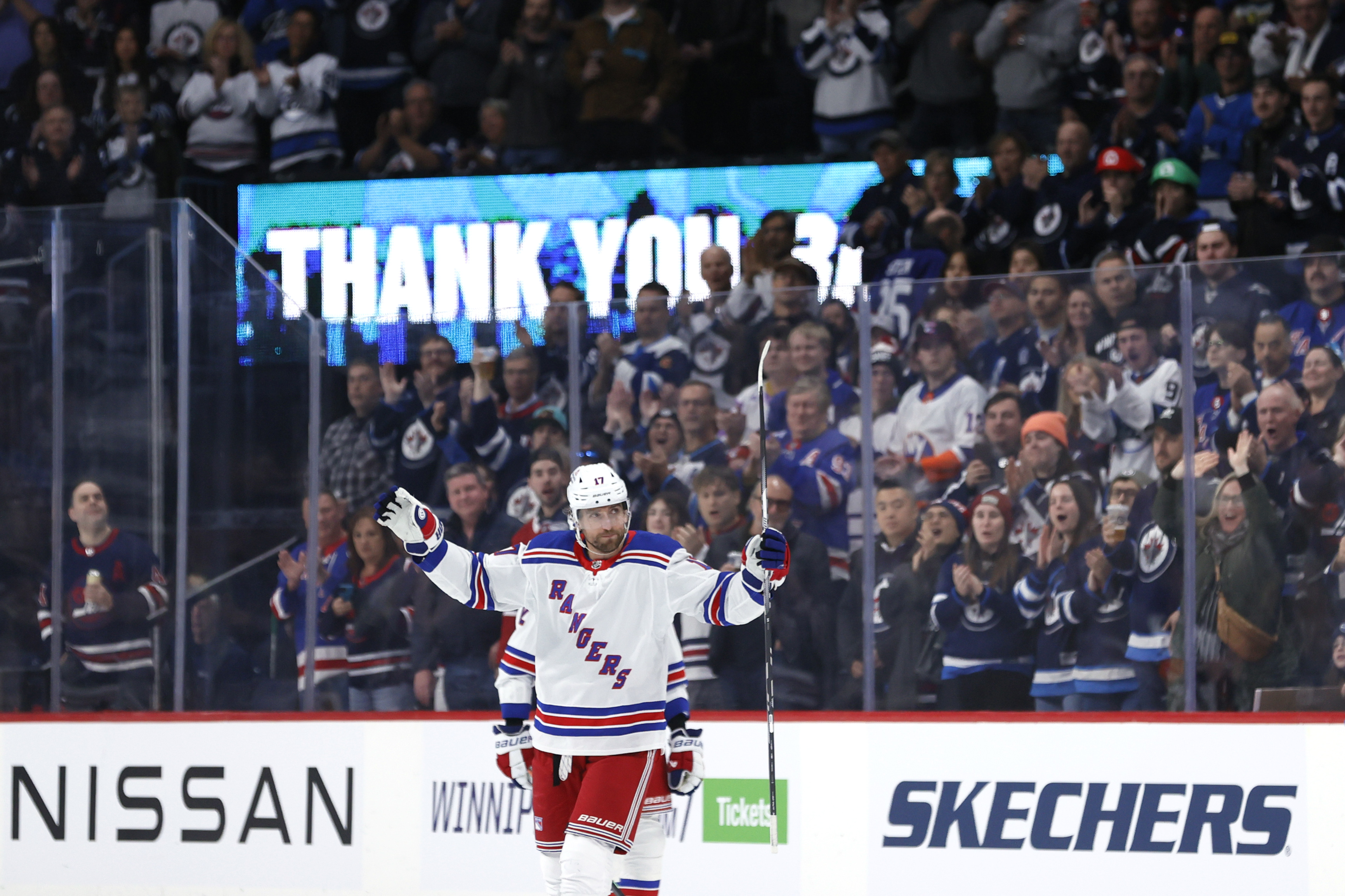 New York Rangers right wing Blake Wheeler (17) salutes fans during a time out in the first period against the Winnipeg Jets at Canada Life Centre