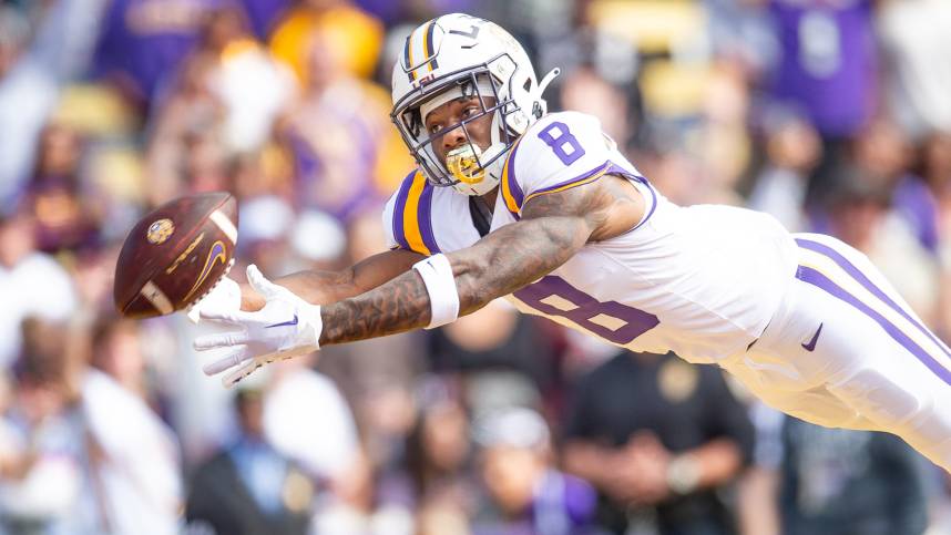 Malik Nabers (New York Giants prospect) 8 dives for a ball as the LSU Tigers take on Texas A&M in Tiger Stadium in Baton Rouge, Louisiana, November 25, 2023.