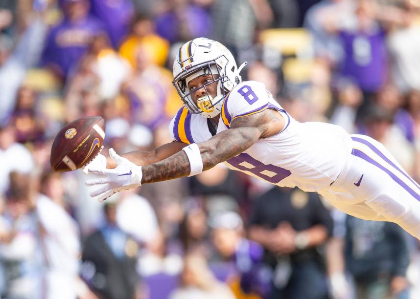 Malik Nabers (New York Giants prospect) 8 dives for a ball as the LSU Tigers take on Texas A&M in Tiger Stadium in Baton Rouge, Louisiana, November 25, 2023.