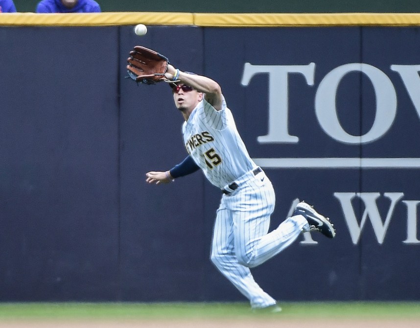 Milwaukee Brewers right fielder Tyrone Taylor (15) makes a running catch of ball hit by New York Mets left fielder Jeff McNeil (not pictured) in the fourth inning at American Family Field